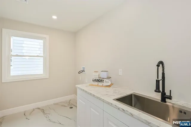 a bathroom with a sink and a window