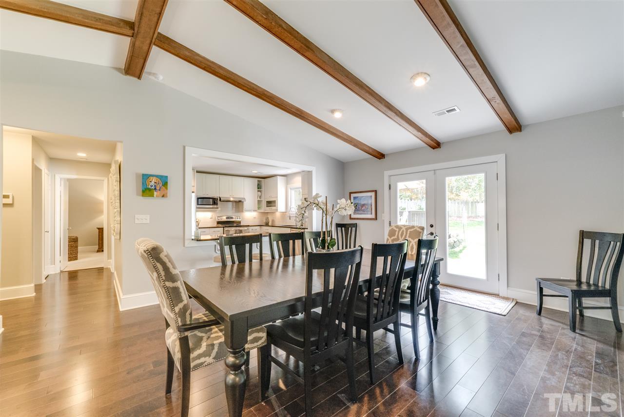 3105 Chancery Place Raleigh, NC 27607 - Photo 2 of 25 a view of a dining room with furniture and wooden floor