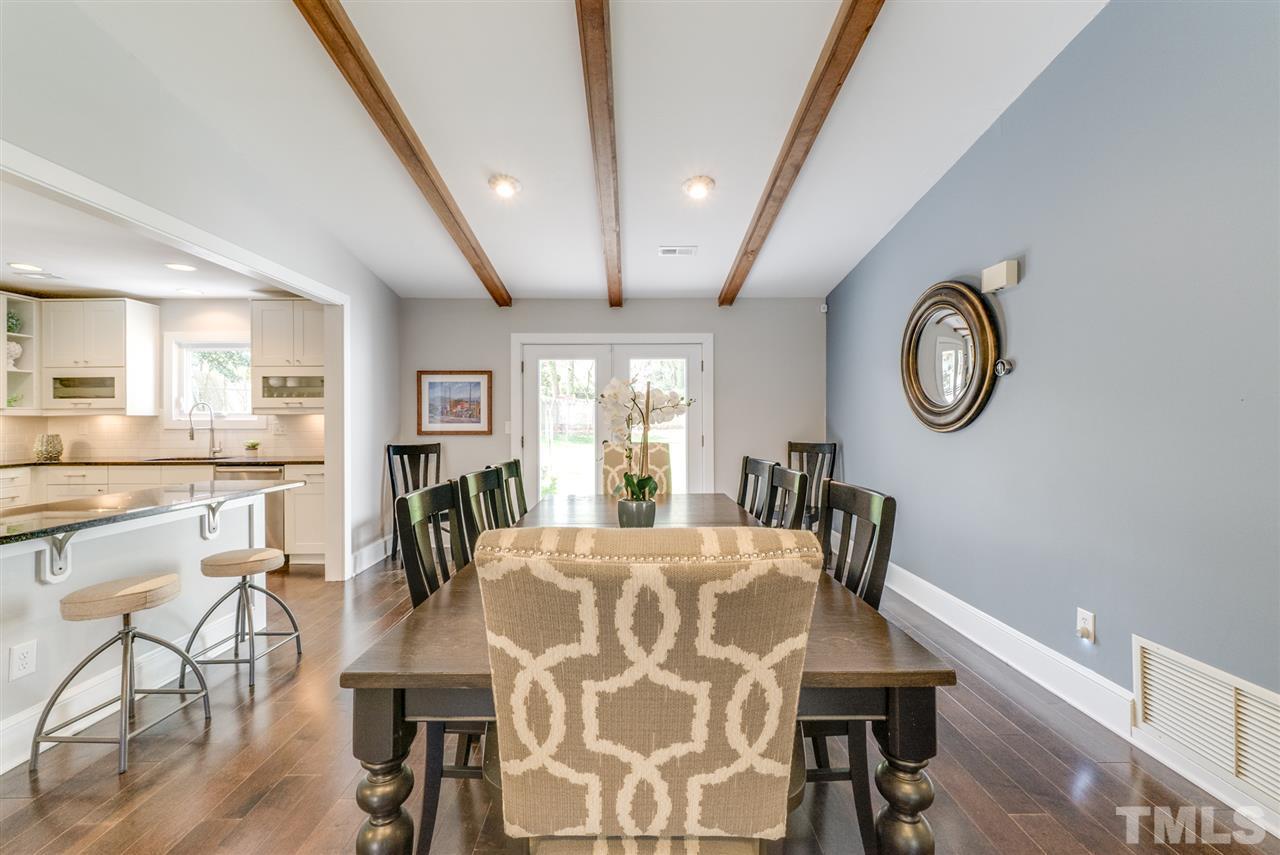 3105 Chancery Place Raleigh, NC 27607 - Photo 3 of 25 a view of a dining room with furniture window and wooden floor