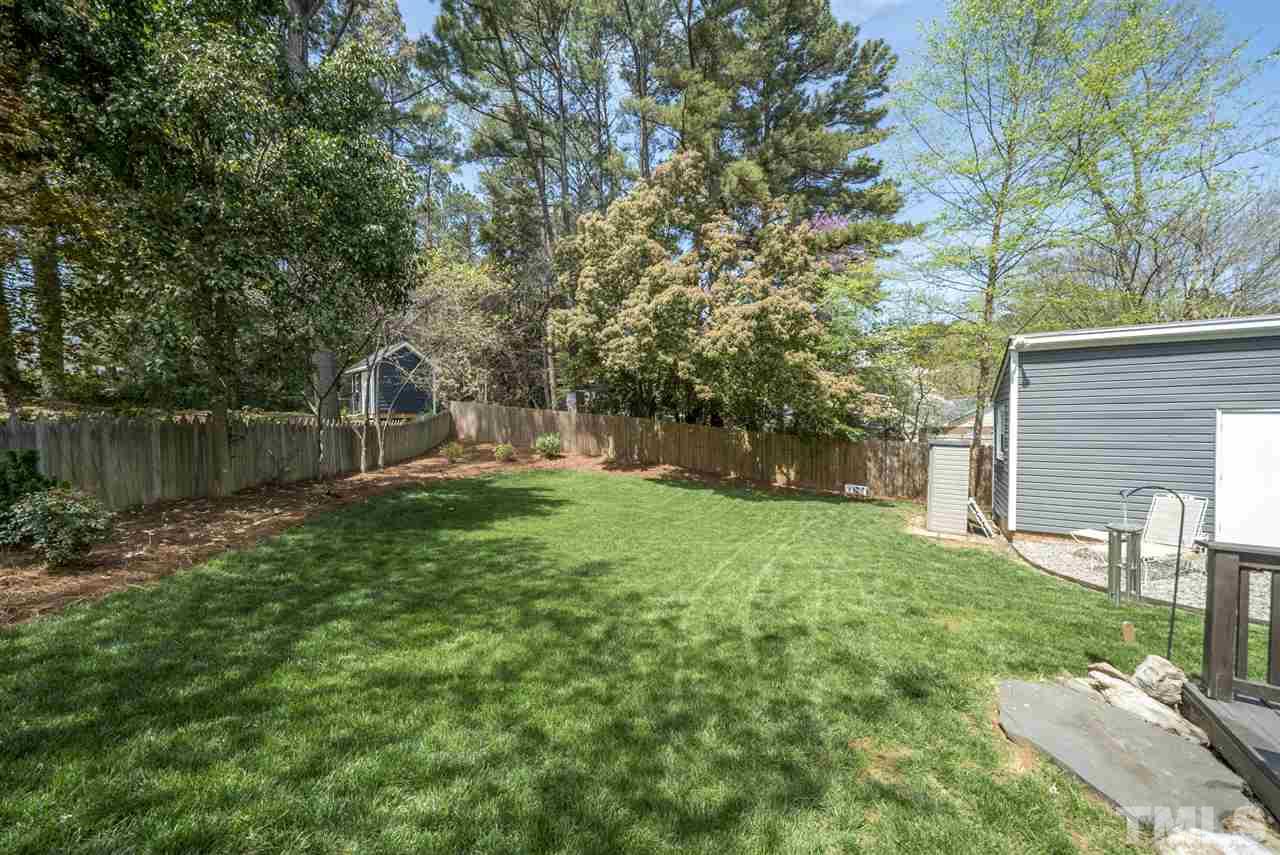 3105 Chancery Place Raleigh, NC 27607 - Photo 23 of 25 a backyard of a house with lots of green space