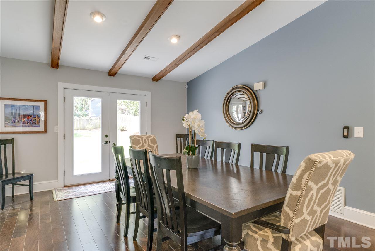 3105 Chancery Place Raleigh, NC 27607 - Photo 4 of 25 a view of a dining room with furniture and a large window