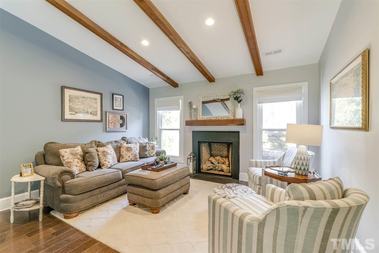 3105 Chancery Place Raleigh, NC 27607 - Photo 5 of 25 a living room with furniture and a fireplace