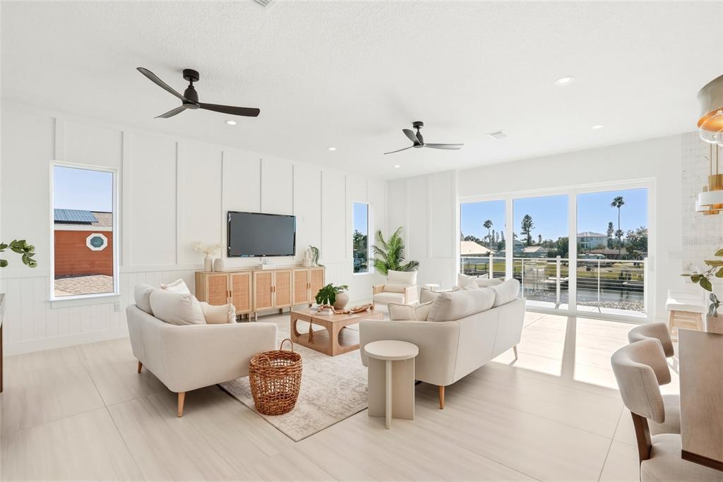 534 Crystal Drive Madeira Beach, FL 33708 - Photo 14 of 68 a living room with furniture and a flat screen tv