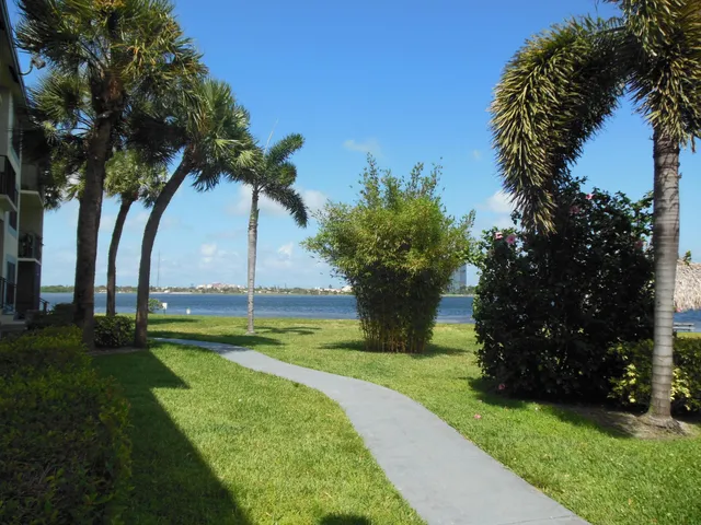 a swimming pool with outdoor seating and yard