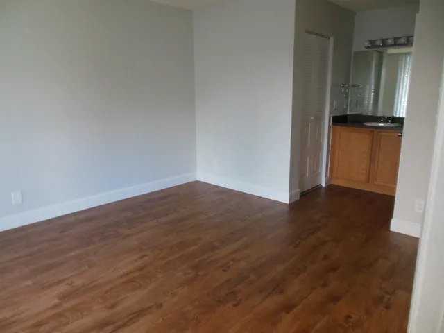 a view of a garden with sitting area