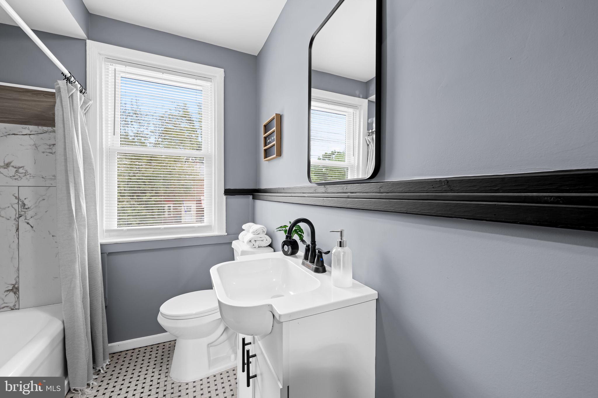 1509 Ralworth Road Baltimore, MD 21218 - Photo 16 of 32 Modern bathroom with stylish gray accents.