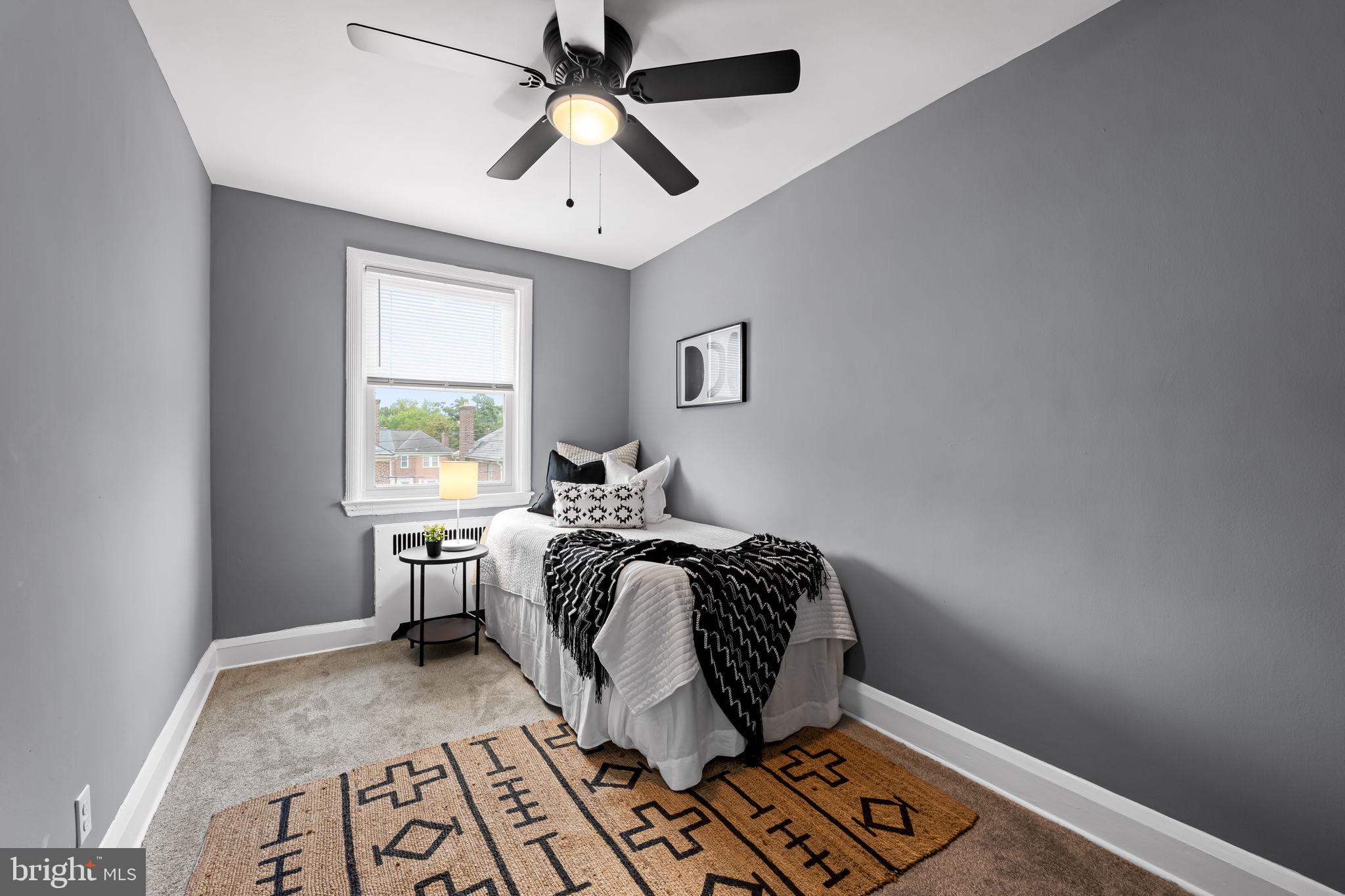 1509 Ralworth Road Baltimore, MD 21218 - Photo 18 of 32 Cozy gray-hued bedroom with modern charm.