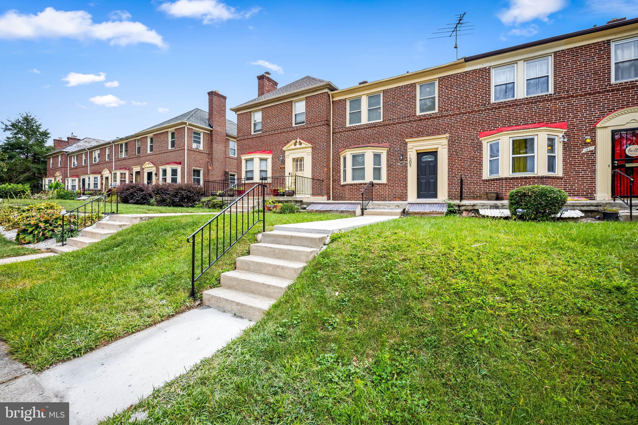 1509 Ralworth Road Baltimore, MD 21218 - Photo 29 of 32 Charming brick townhomes with lush greenery.
