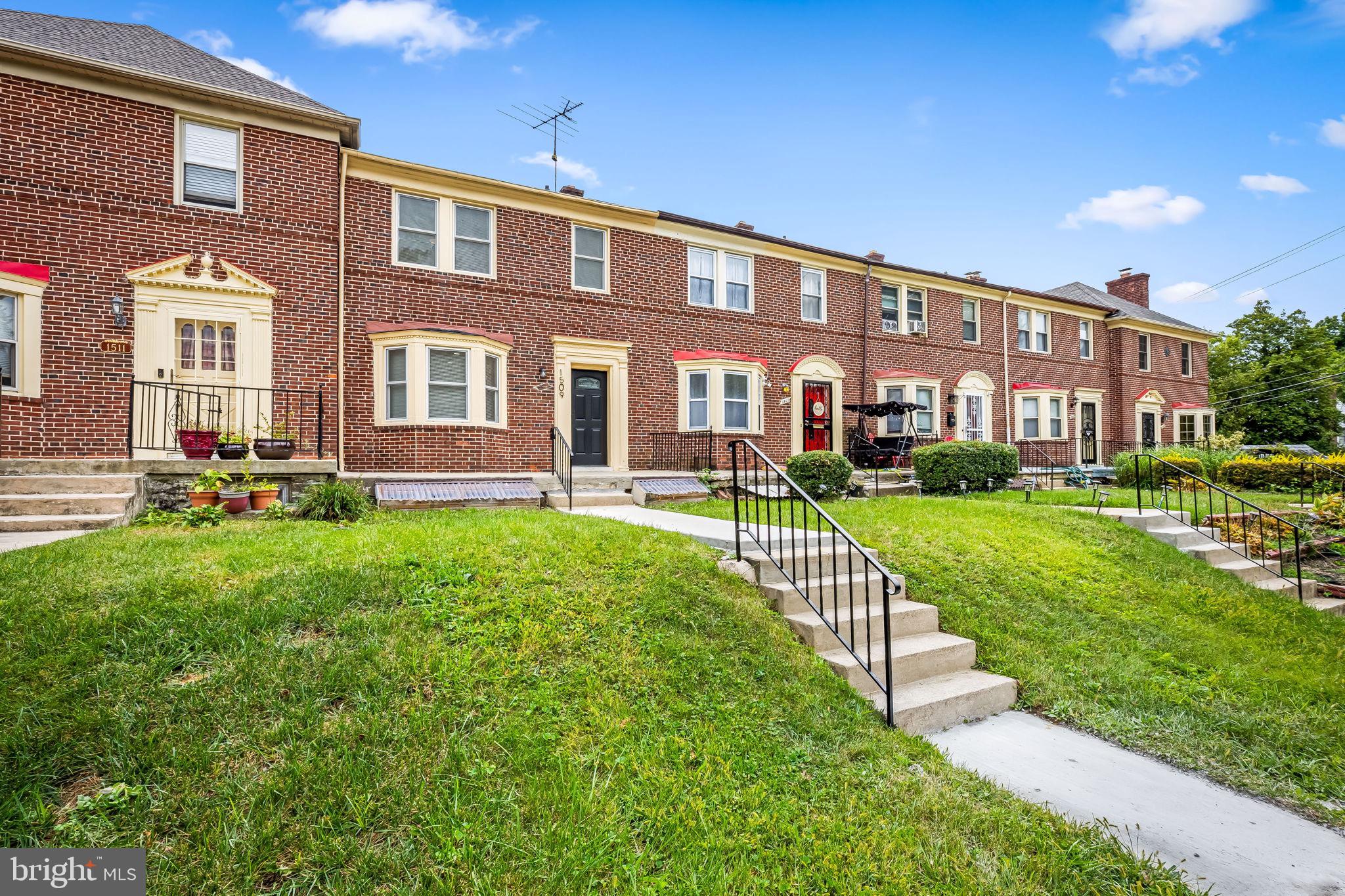 1509 Ralworth Road Baltimore, MD 21218 - Photo 30 of 32 Charming brick townhomes with lush greenery.