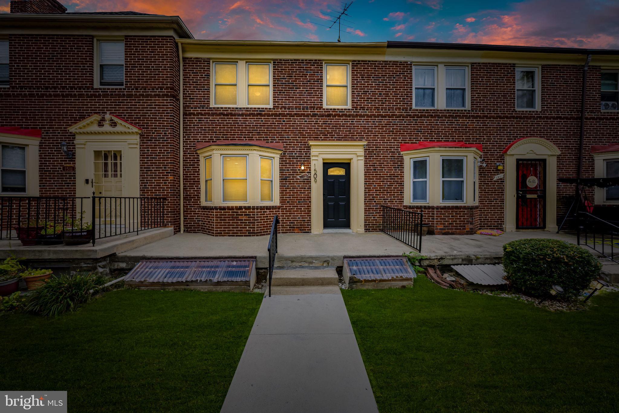 1509 Ralworth Road Baltimore, MD 21218 - Photo 32 of 32 Charming brick townhome at twilight glow.