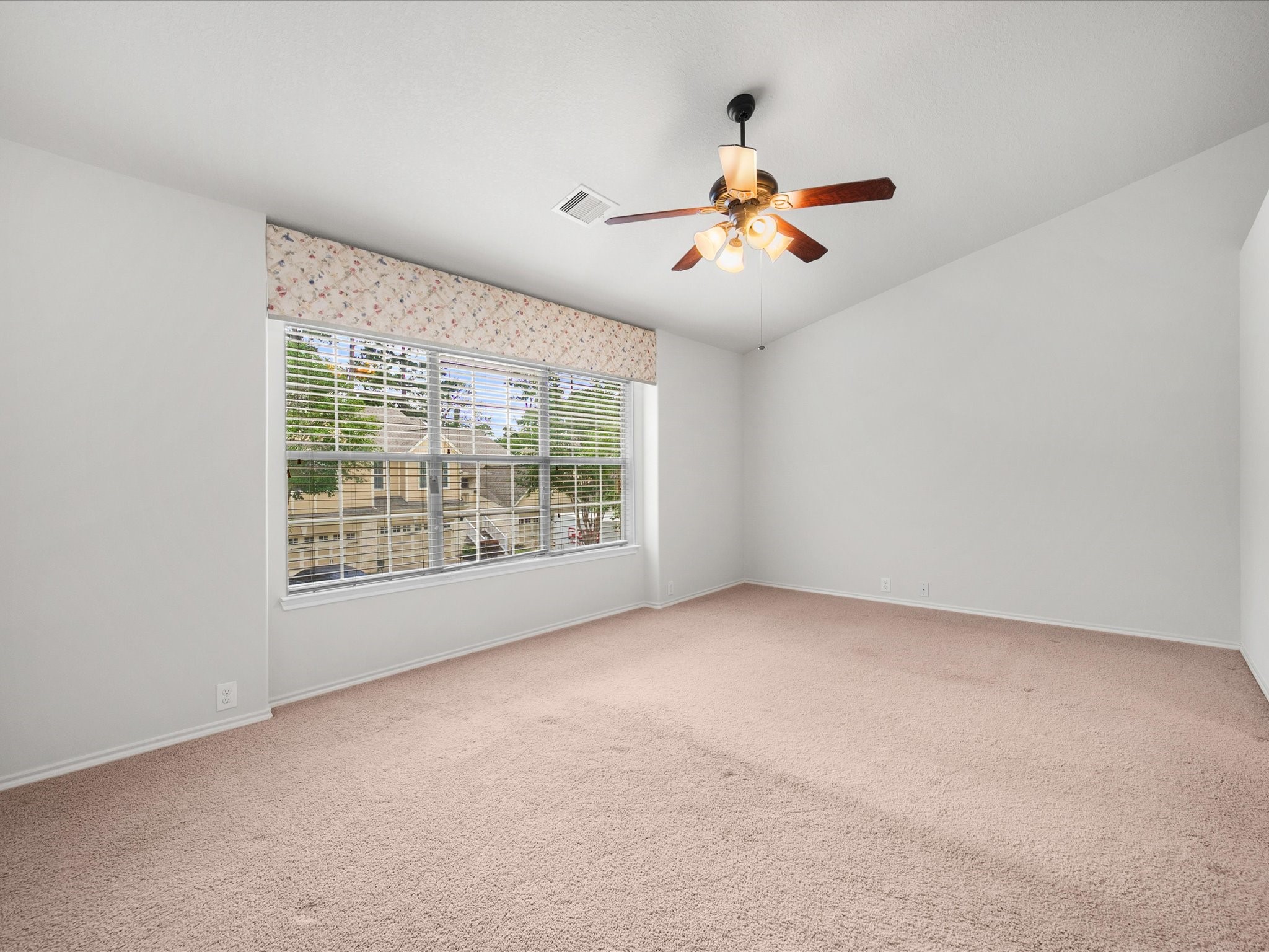 13600 Breton Ridge Street, Unit 31C Houston, TX 77070 - Photo 18 of 31 Located upstairs for added privacy, the expansive primary suite offers a peaceful retreat with high ceilings, large windows, and plenty of space to unwind at the end of the day.