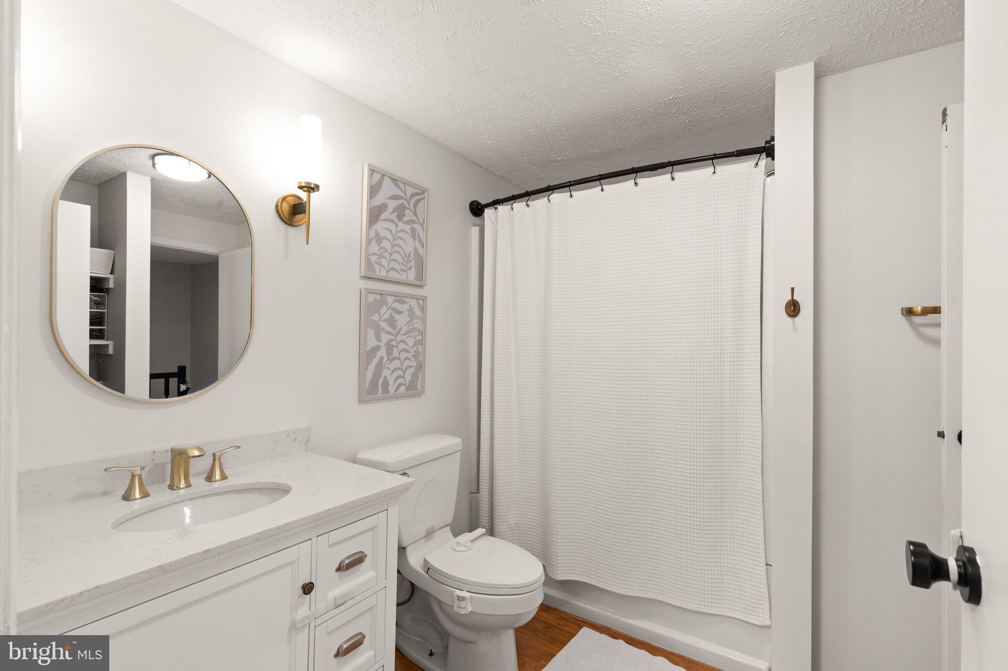 2530 Merrick Court Abingdon, MD 21009 - Photo 16 of 23 a bathroom with a granite countertop sink toilet and shower