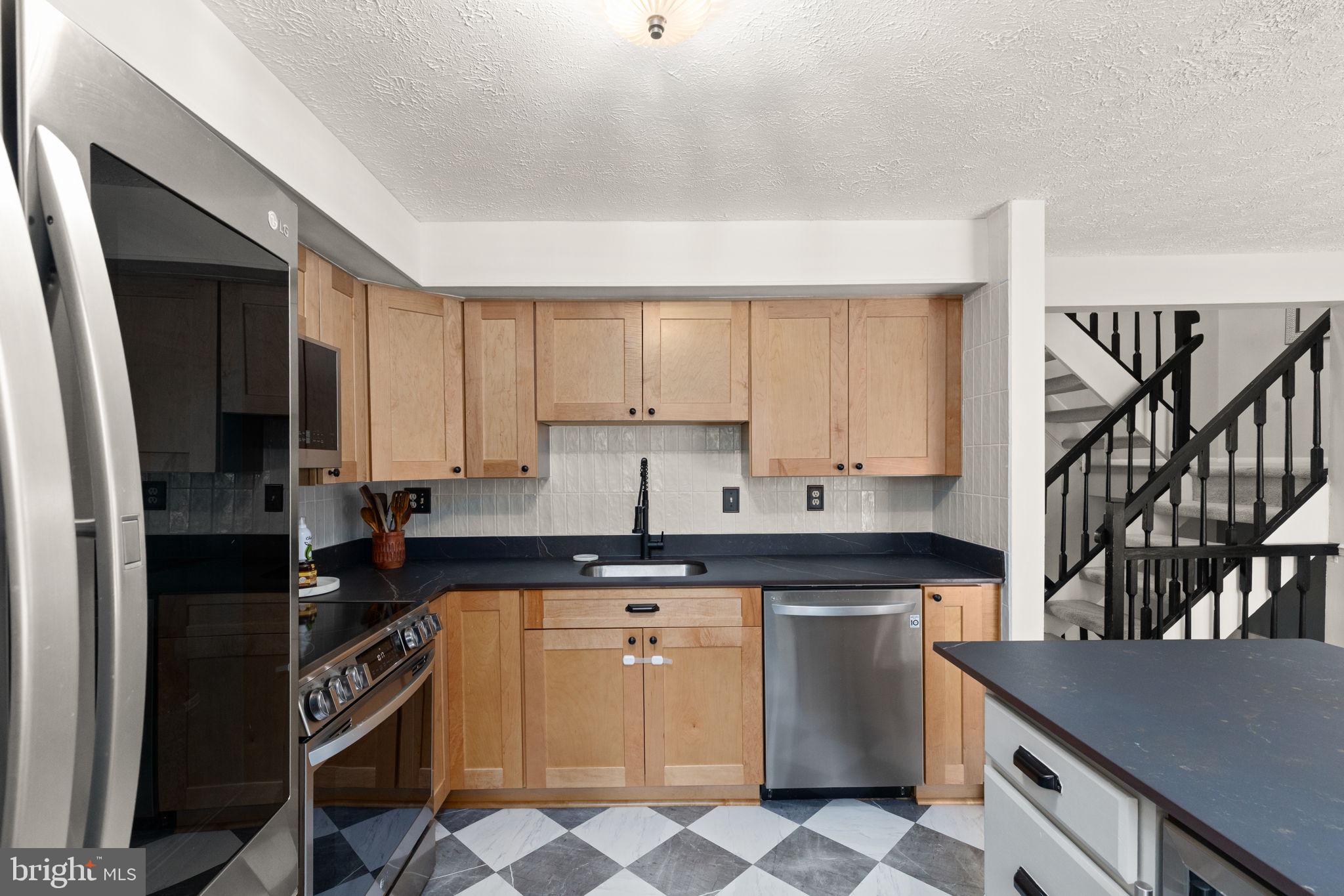 2530 Merrick Court Abingdon, MD 21009 - Photo 4 of 23 a kitchen with stainless steel appliances granite countertop a stove a sink and a microwave