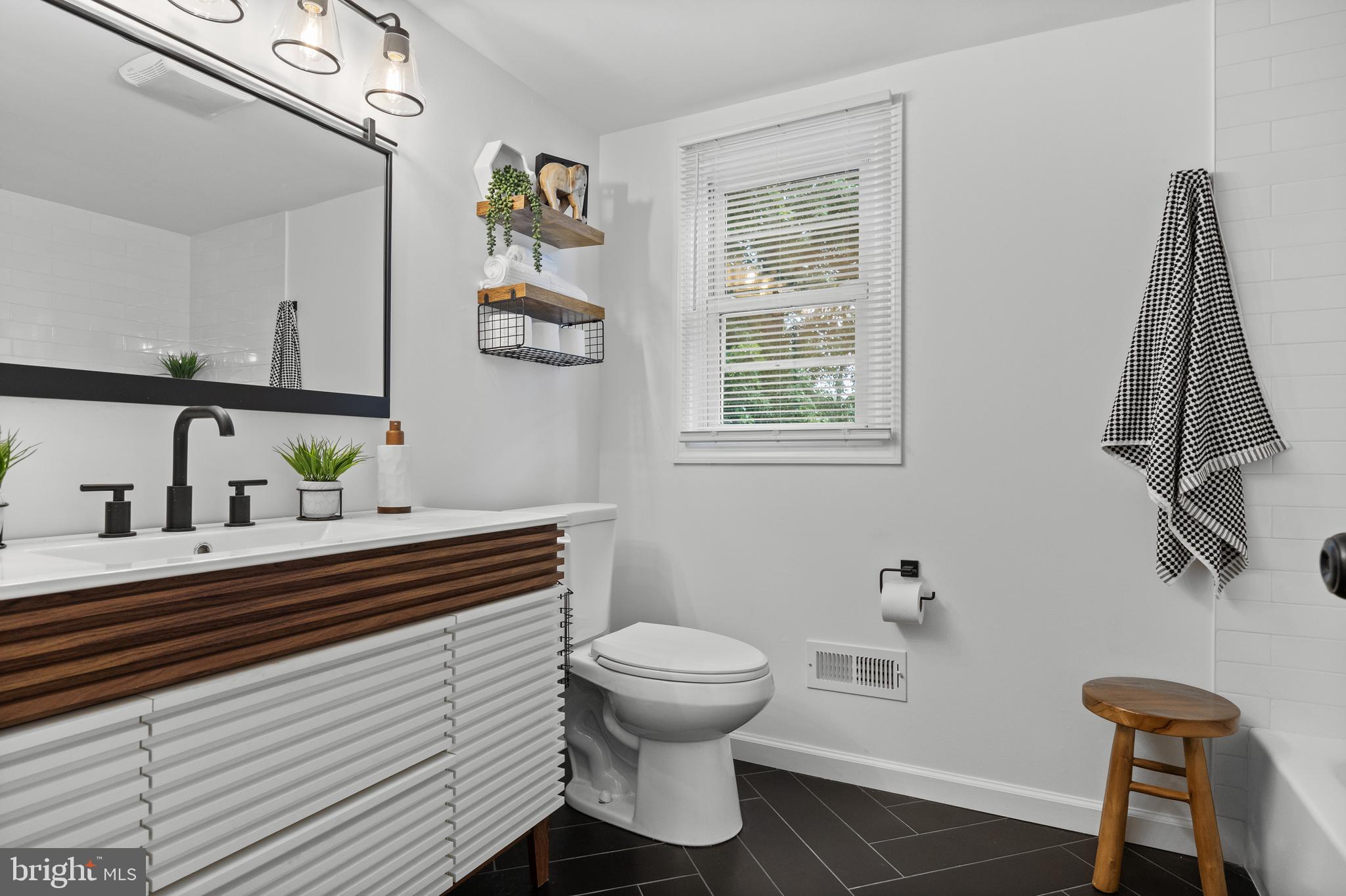 11 East Sutton Avenue Moorestown, NJ 08057 - Photo 19 of 27 a bathroom with a sink a mirror and a toilet