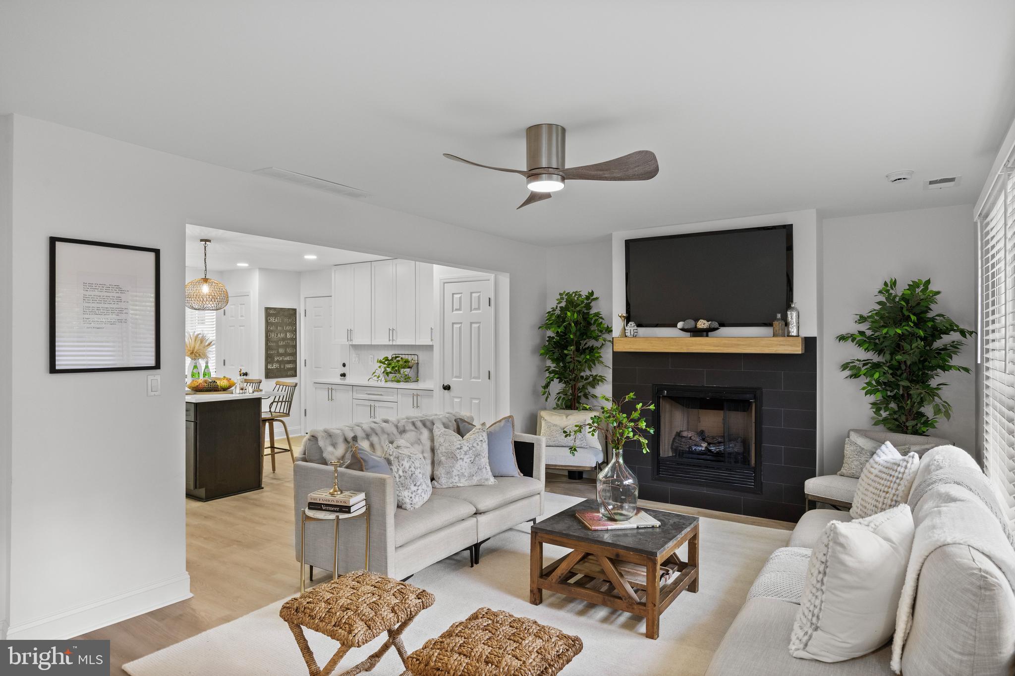 11 East Sutton Avenue Moorestown, NJ 08057 - Photo 3 of 27 a living room with furniture a fireplace and a flat screen tv