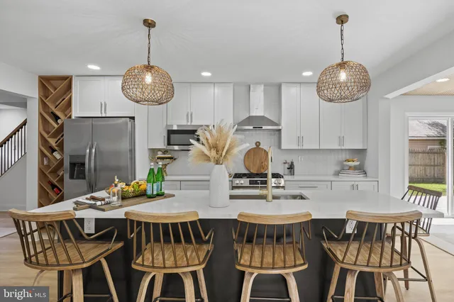 a view of a dining room with furniture wooden floor and chandelier