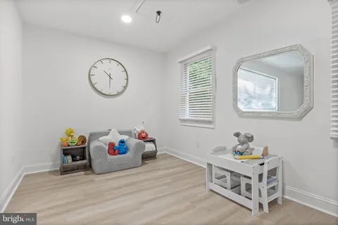 a bed room with a bed and a window