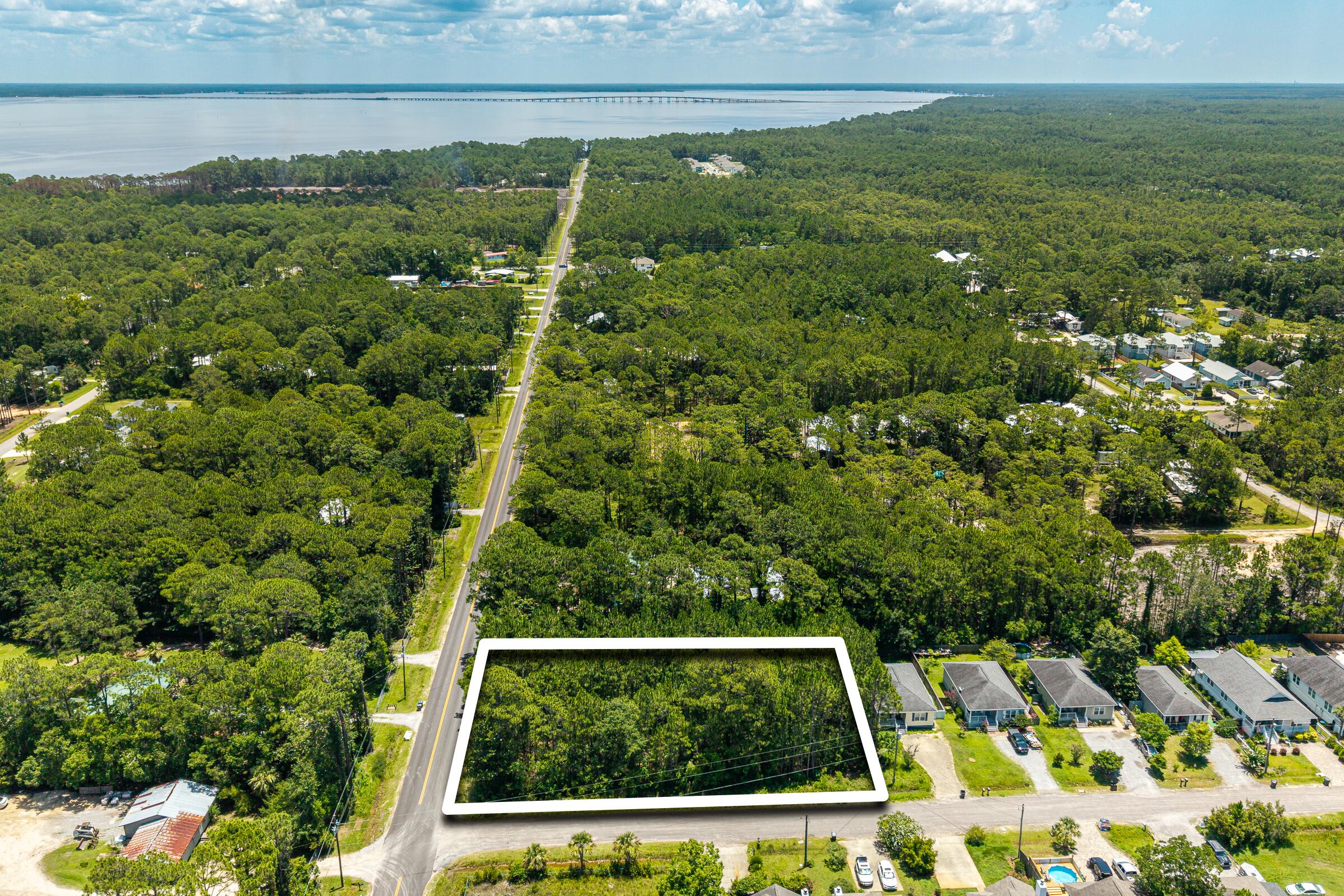 209 East Nursery Road Santa Rosa Beach, FL 32459 - Photo 2 of 11 a view of a yard