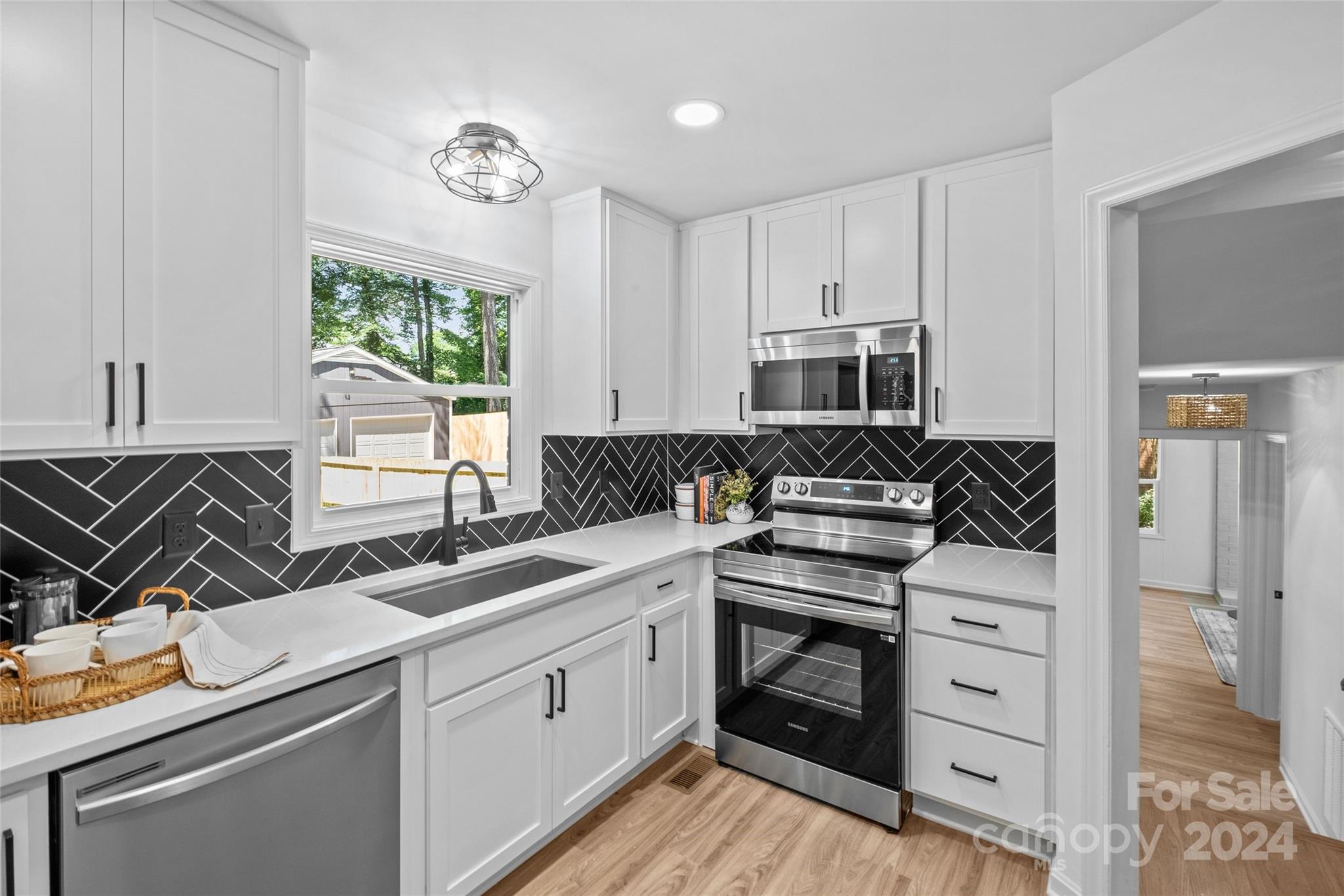 5807 Ruth Drive Charlotte, NC 28215 - Photo 11 of 41 a kitchen with a sink stove and microwave