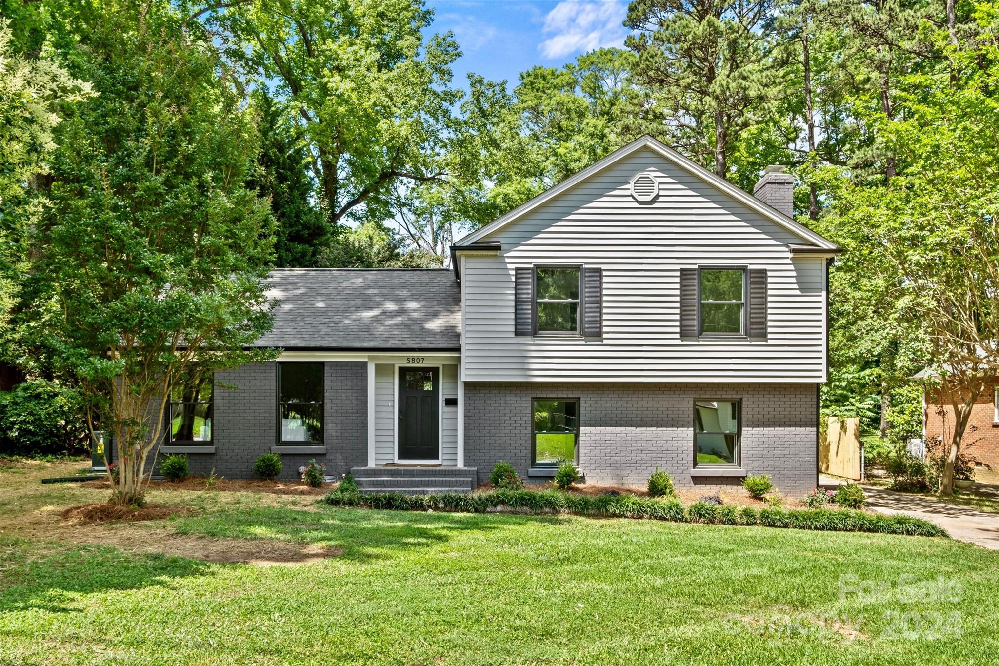 5807 Ruth Drive Charlotte, NC 28215 - Photo 2 of 41 a front view of a house with a yard
