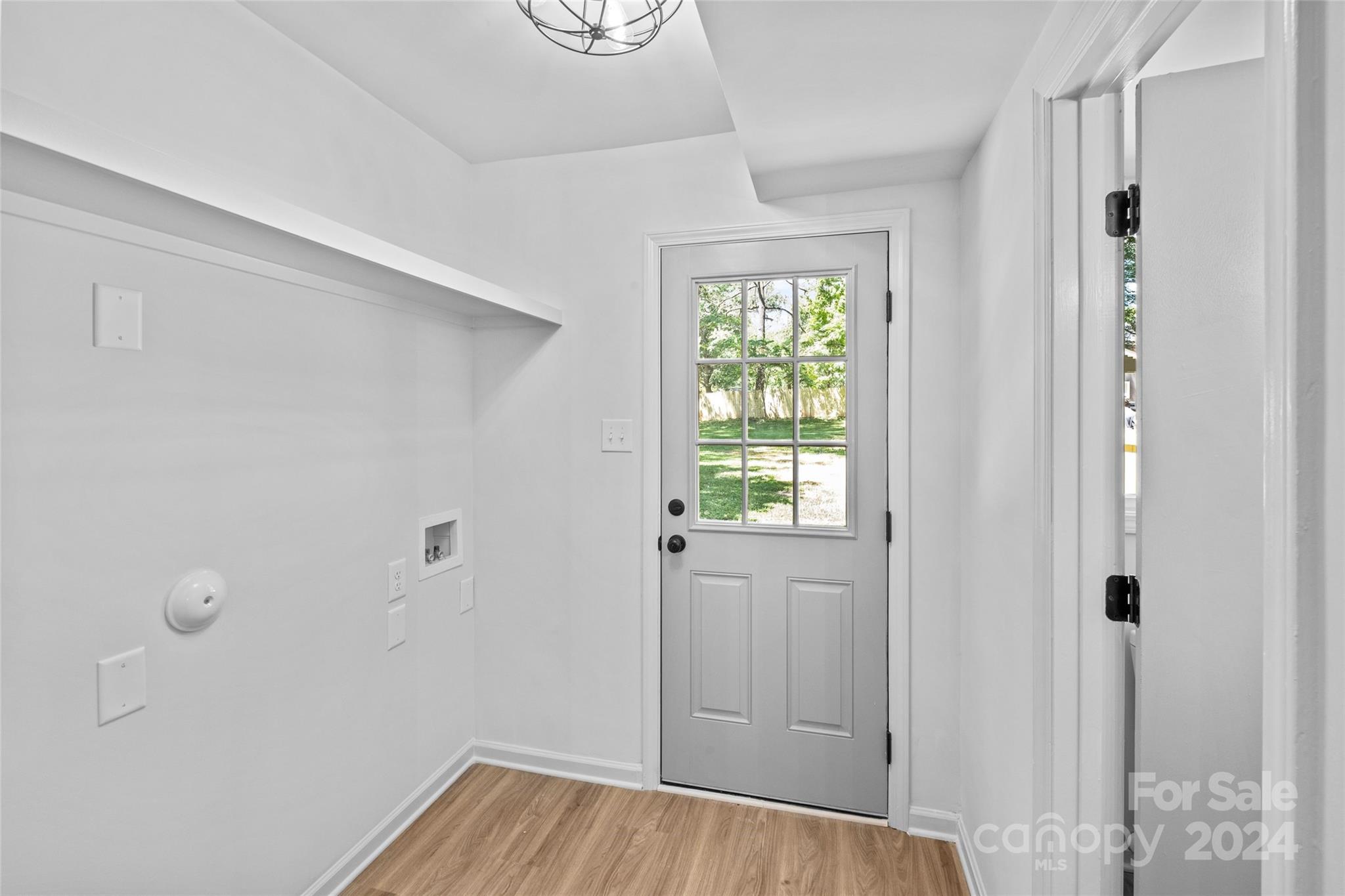 5807 Ruth Drive Charlotte, NC 28215 - Photo 27 of 41 a view of a hallway with wooden floor