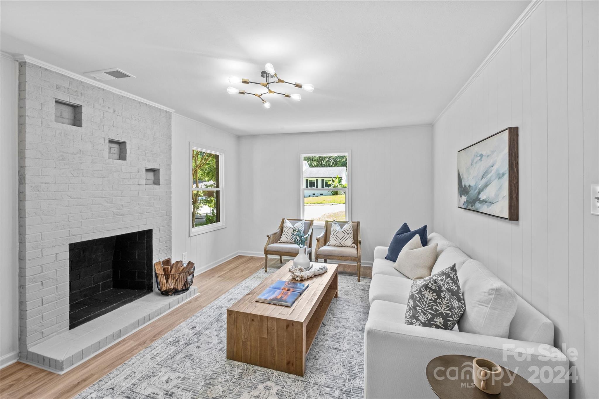 5807 Ruth Drive Charlotte, NC 28215 - Photo 32 of 41 a living room with furniture a fireplace and a window