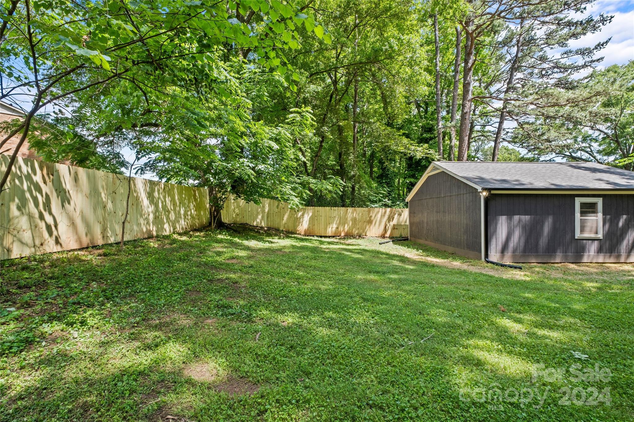 5807 Ruth Drive Charlotte, NC 28215 - Photo 39 of 41 a view of a backyard with a small cabin