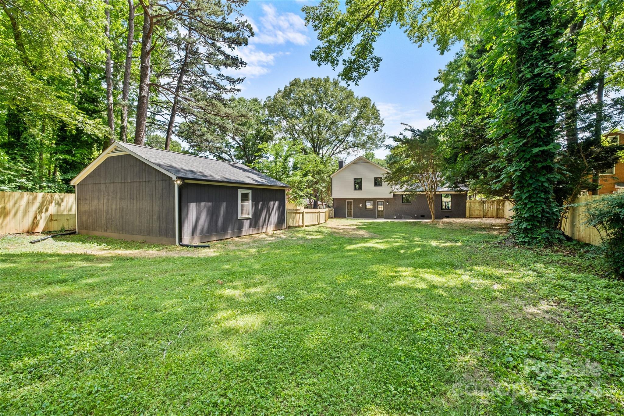5807 Ruth Drive Charlotte, NC 28215 - Photo 40 of 41 a front view of a house with a garden