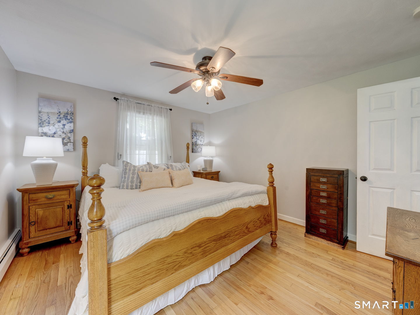 39 Freedom Drive Canton, CT 06019 - Photo 16 of 37 a bedroom with a bed and a chandelier