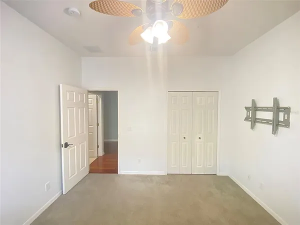 a bathroom with a sink a toilet and shower a mirror