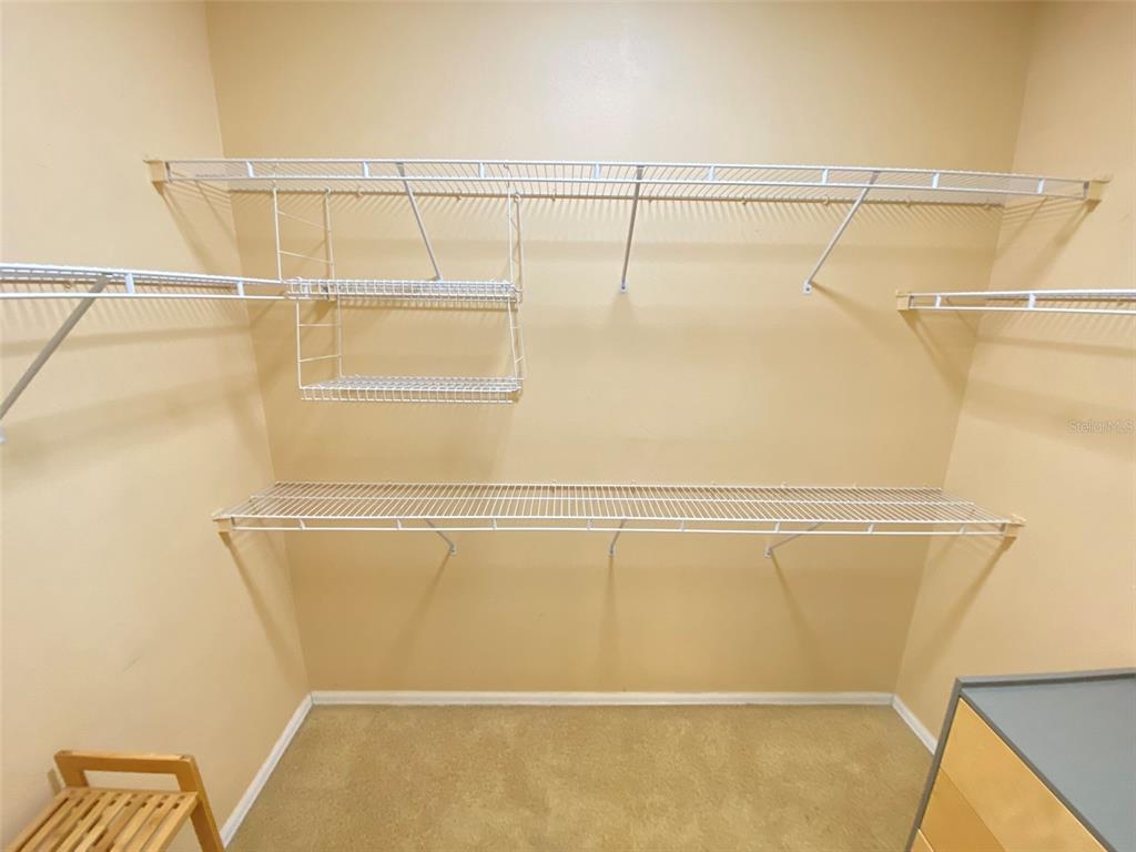 8763 Coco Plum Place Orlando, FL 32827 - Photo 21 of 26 a view of a room with racks on the wall