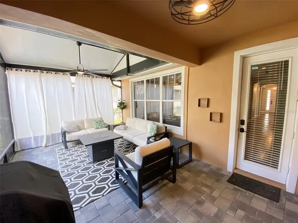 a living room with a large bed and a large window