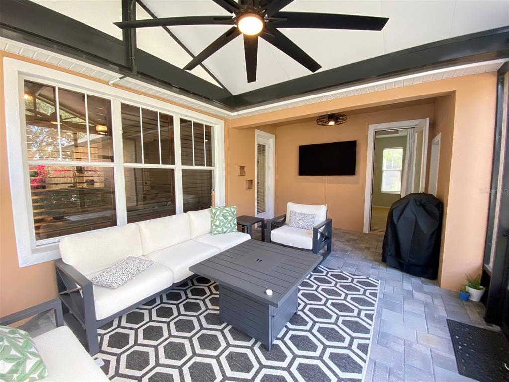 8763 Coco Plum Place Orlando, FL 32827 - Photo 26 of 26 a living room with a large bed and a large window