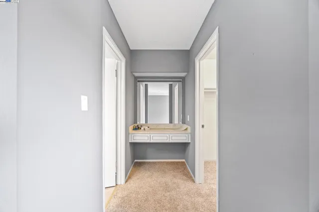 a view of hall way with furniture