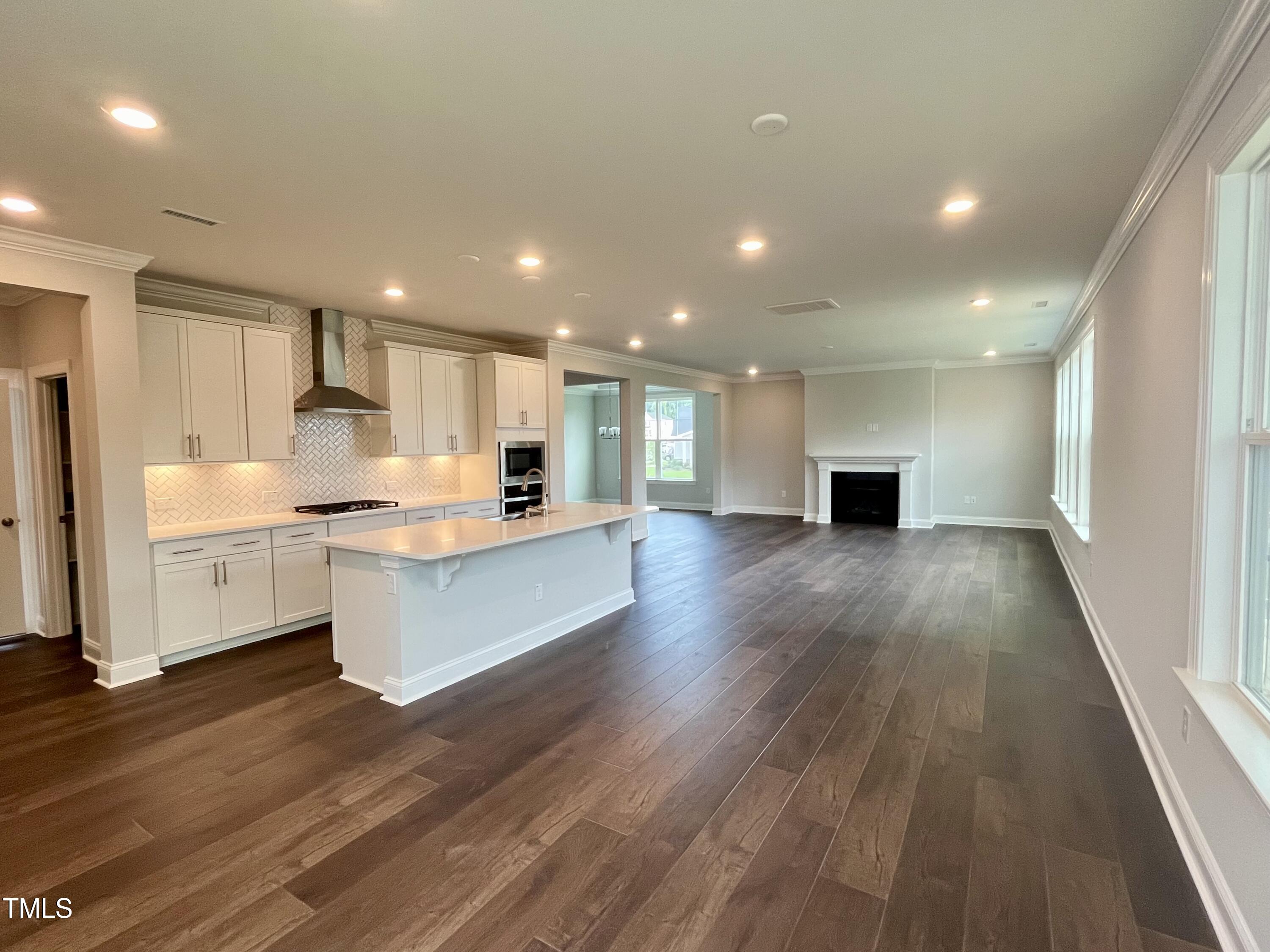 961 Jasper Mine Trail Raleigh, NC 27610 - Photo 2 of 38 a view of kitchen with wooden floor and electronic appliances