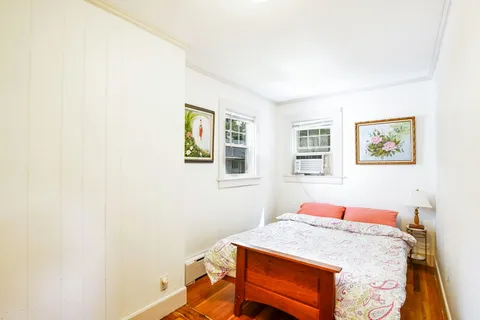 a bed room with a bed and a desk