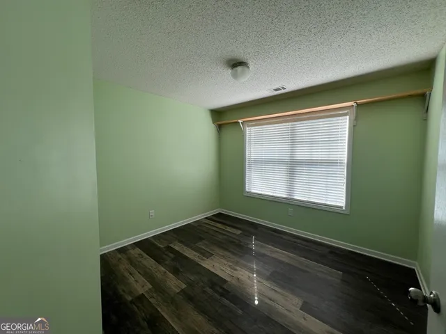 a view of a room that has a window in it