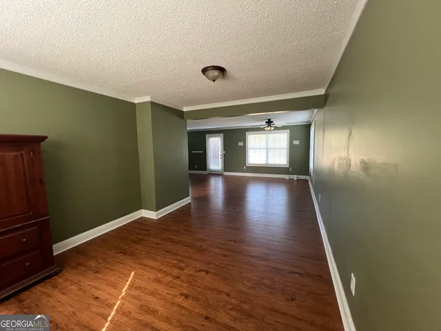 a view of livingroom with hardwood floor and ceiling fan