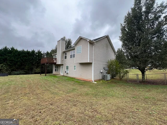 a house with a tree in front of it