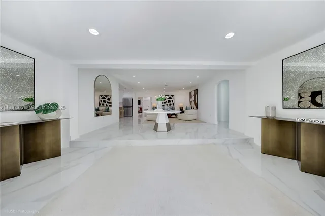 a lobby with furniture and window