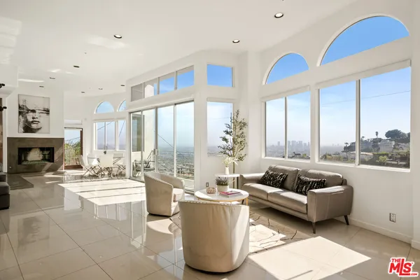 a kitchen with stainless steel appliances a sink a stove and a refrigerator