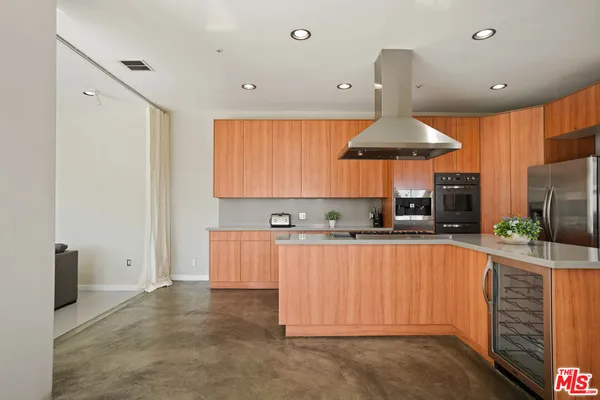 a kitchen with granite countertop a sink stove and cabinets