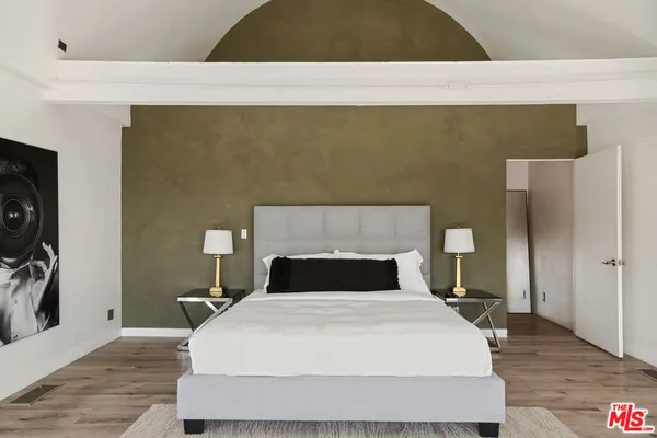 a bathroom with a sink a mirror and shower