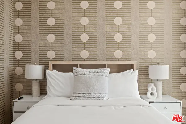 a dining room with furniture and a window