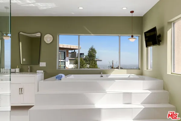 a view of a balcony with a floor to ceiling window