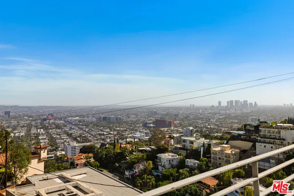 a bedroom with a bed and flat screen tv
