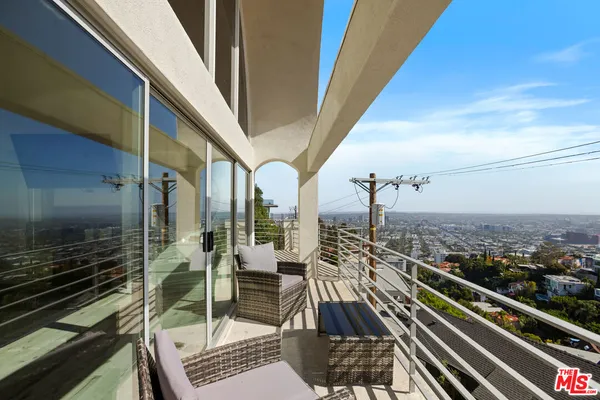 a bathroom with a shower and a sink