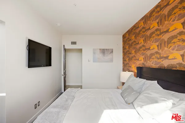 a front view of a multi story building with yard