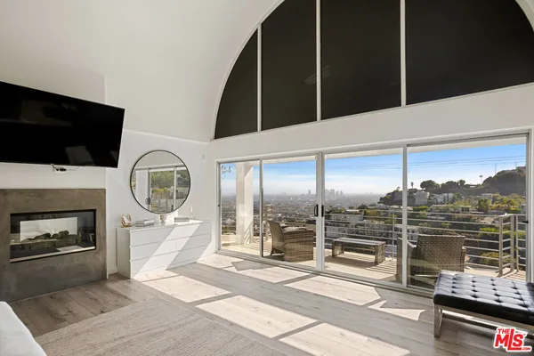 a bedroom with a bed and walk in closet