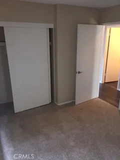 a view of an empty room and a window